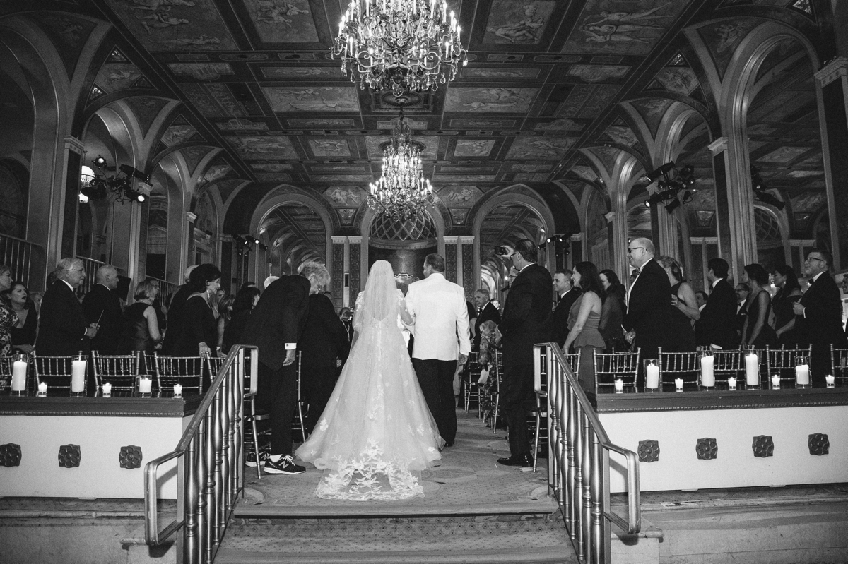 Plaza Hotel Wedding NYC Luxury Royal Wedding Ceremony Black and White Bride train down the aisle