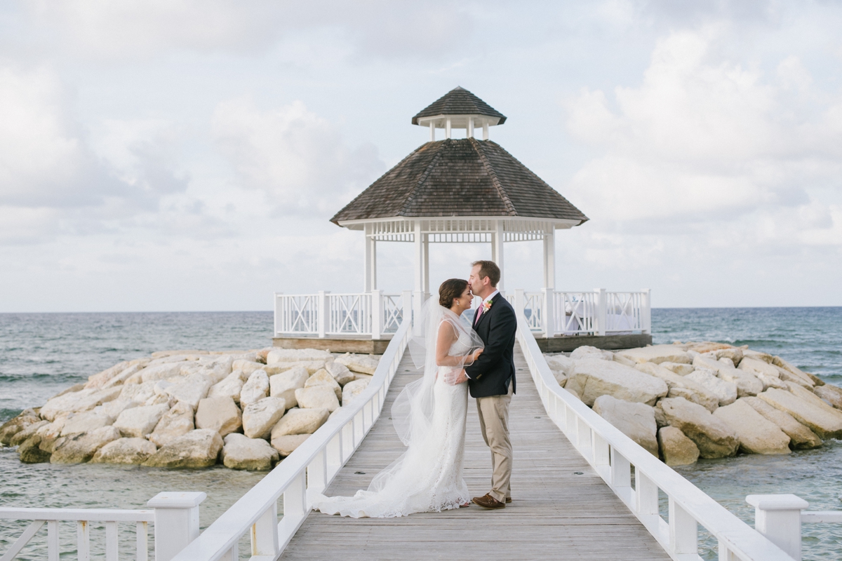 Jamaican Destination Wedding Island Resort sunshine portraits palm trees beach Caribbean bride and groom scenic kiss