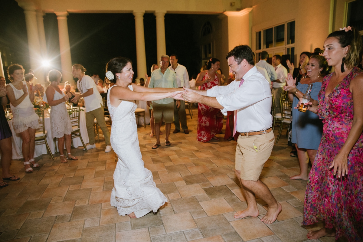 Jamaican Destination Wedding Island Resort sunshine portraits palm trees beach Caribbean bride and groom candid happy dancing