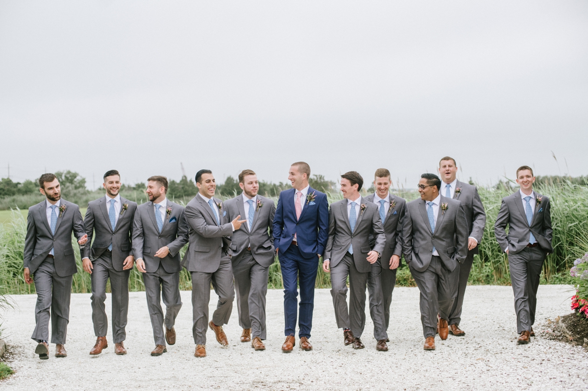 June Wedding Bonnet Island Estate Manahawkin LBI Long Beach Island Beach Jersey Shore Summer Ship Bottom soft pastel color palette floral design flowers bouquet happy couple laughter candid water bay island boardwalk dock bridal party groomsmen navy and gray suits happy laughing