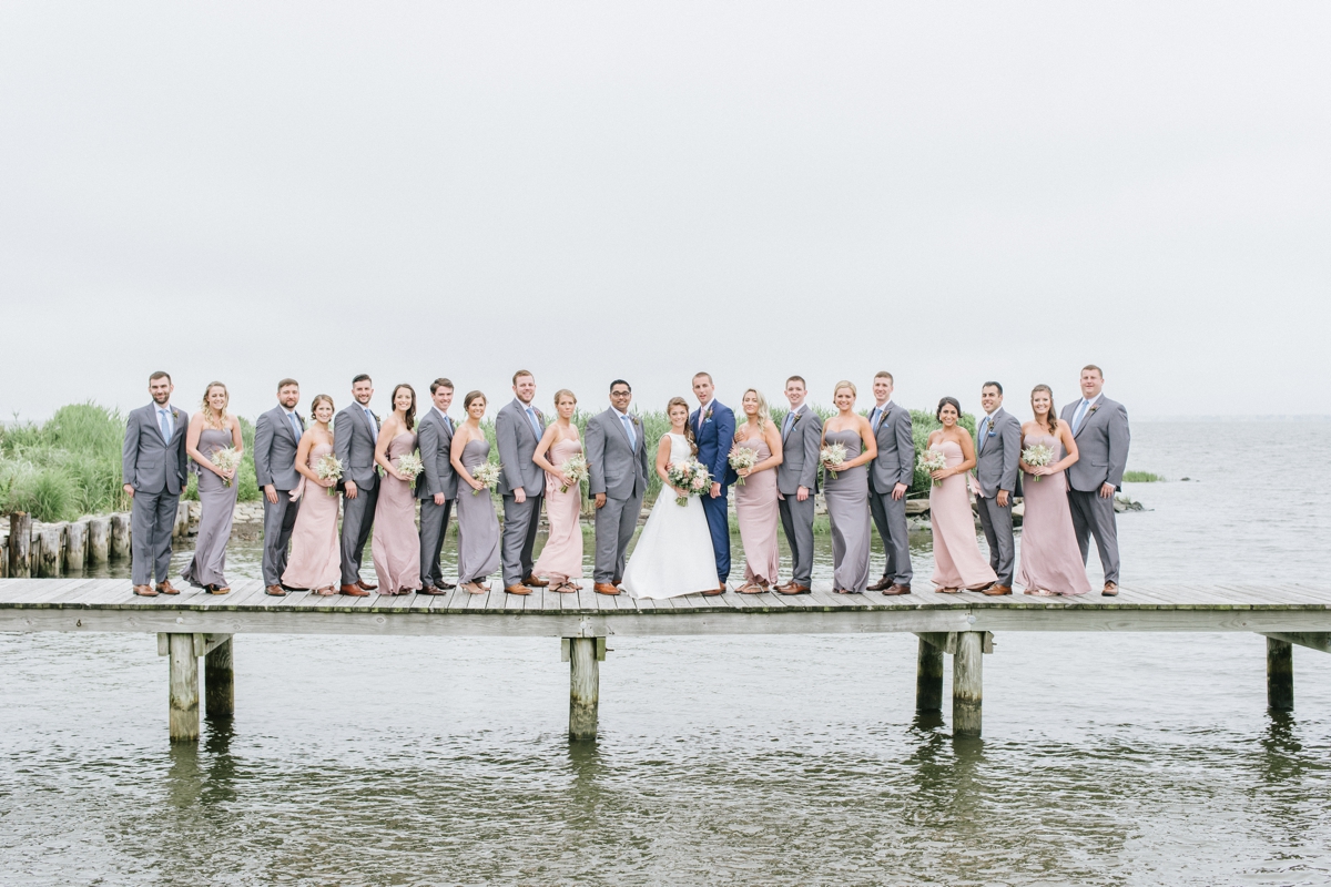 June Wedding Bonnet Island Estate Manahawkin LBI Long Beach Island Beach Jersey Shore Summer Ship Bottom soft pastel color palette floral design flowers bouquet happy couple laughter candid water bay island boardwalk dock bridal party bridesmaids groomsmen blush pink dresses navy and gray suits