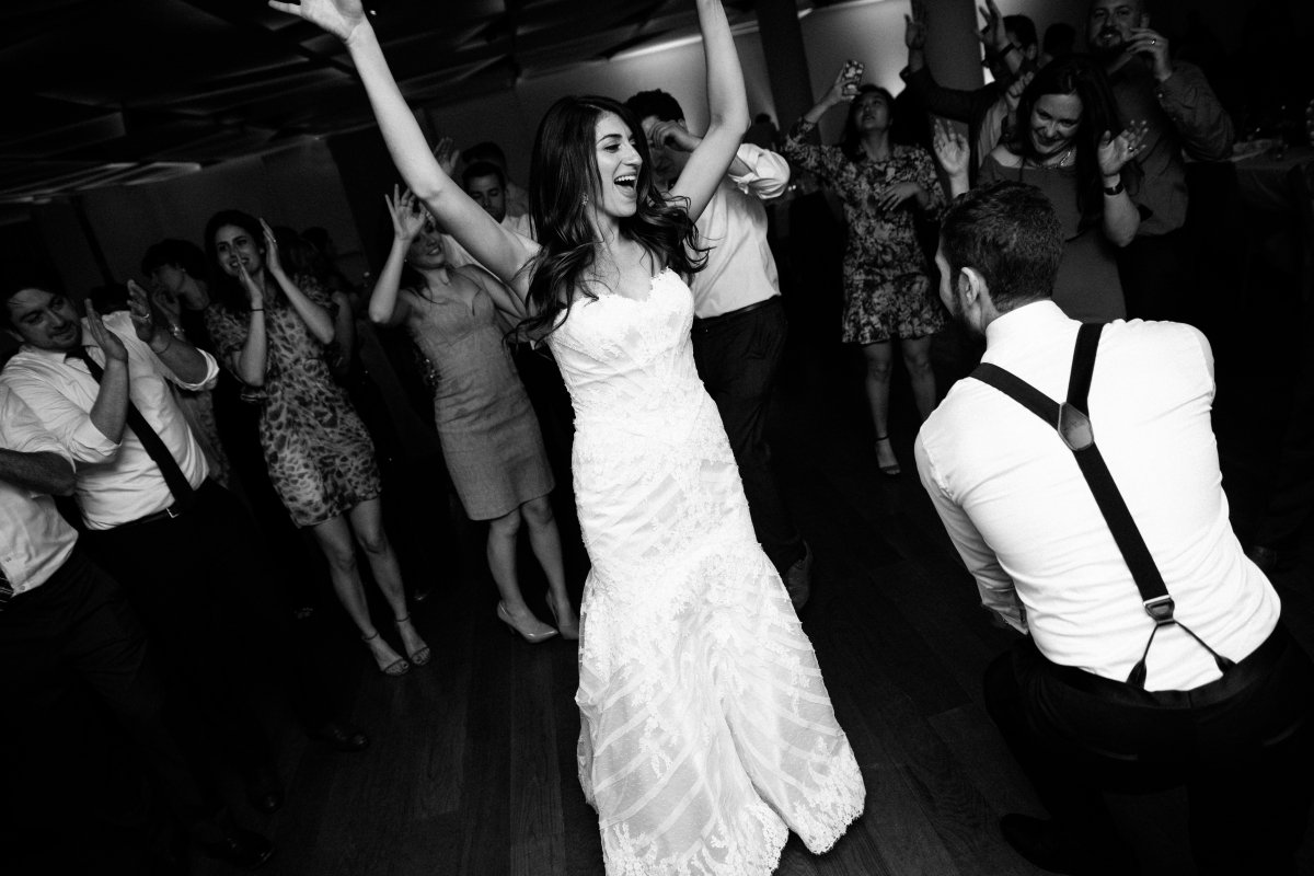 Black and White hora jewish traditions dancing reception happy candid laughing smiling husband and wife Hudson at Maritime Parc Jewish Wedding Jersey City