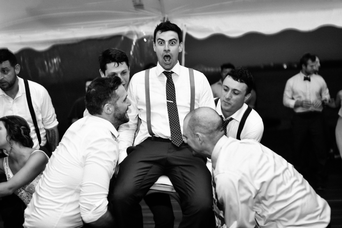 Hora Chair Lift Reactions Black and White Dancing Reception Happy Candid Rhode Island Wedding Destination Newport New England Mount Hope Farm Summer Summertime 