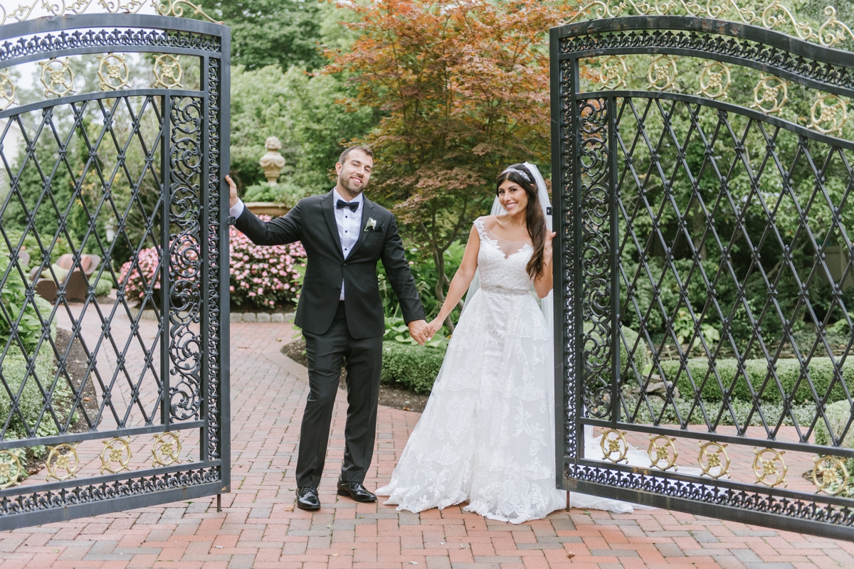gates portraits bride and groom happy bridal party silly fun ashford estate timeless wedding classic nj new jersey allentown love 