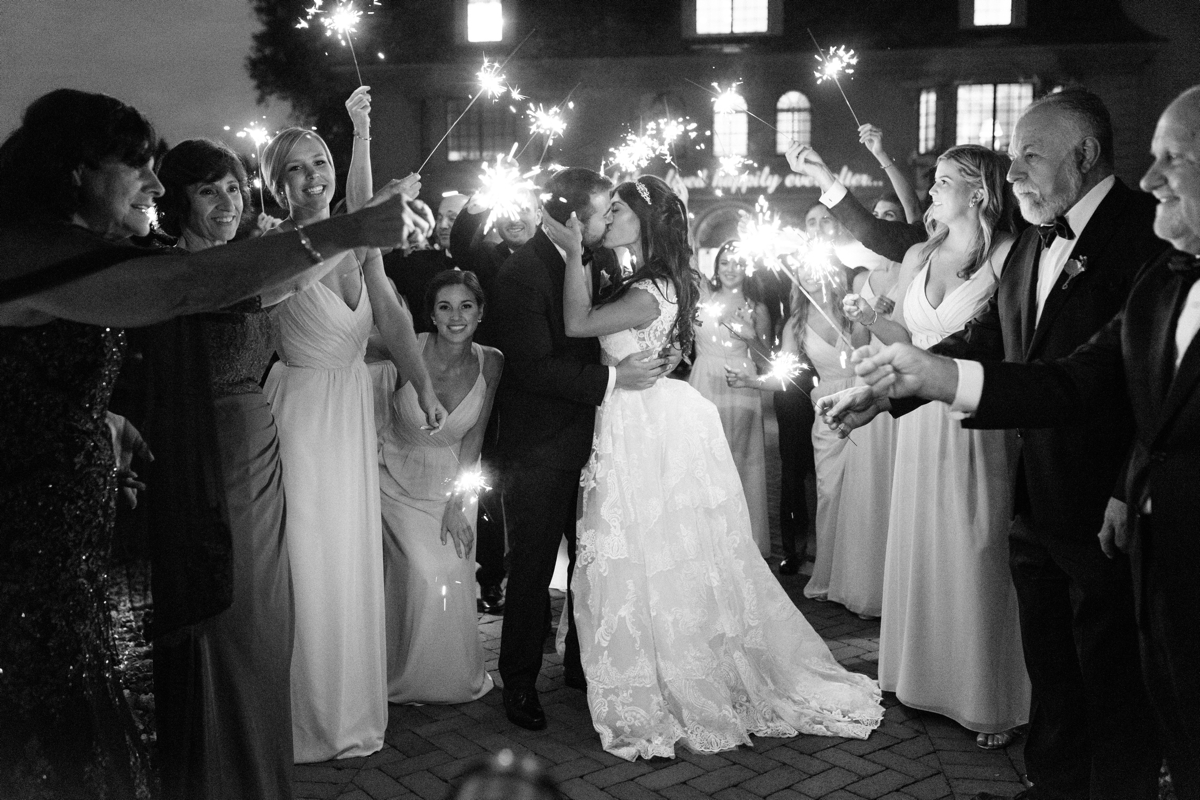 black and white sparkler photo kiss outdoor night shot bridal party silly fun ashford estate timeless wedding classic nj new jersey allentown love 
