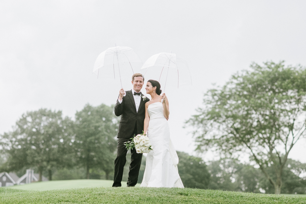 Manasquan River Golf Club Spring Lake NJ St. Catherine's Church Timeless Classic Wedding rainy day umbrellas bride and groom 