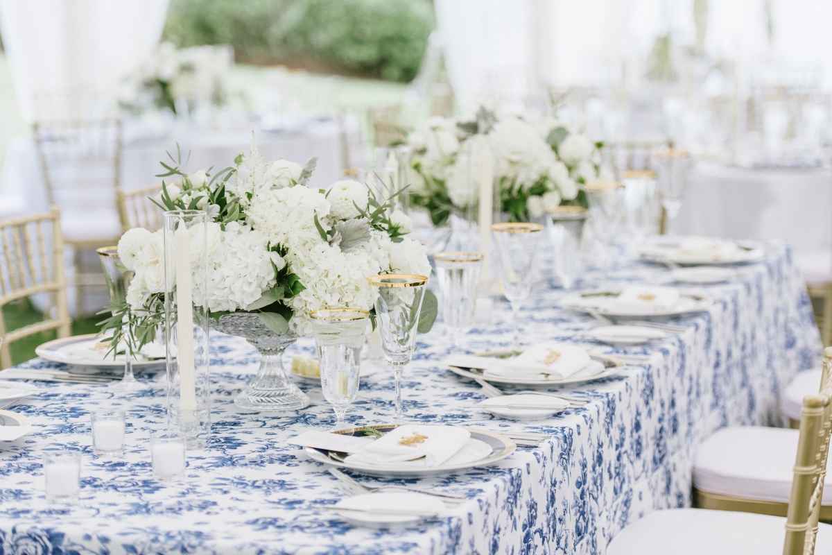 tablescape blue and white color scheme white floral centerpieces candles The Chanler at Cliff Walk Newport Rhode Island New England Elegant Destination Wedding on the coast same sex couple lgbtq love is love gay couple love wins