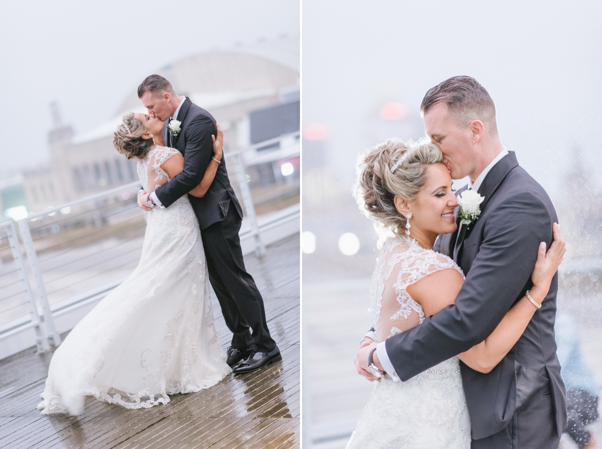 happy candid by the water mist rain view beach One Atlantic Wedding Atlantic City New Jersey