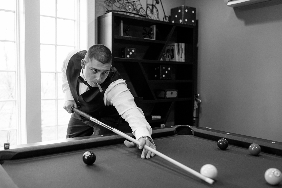 Groom plays pool at the Ryland Inn in NJ - New Jersey wedding photography and Video