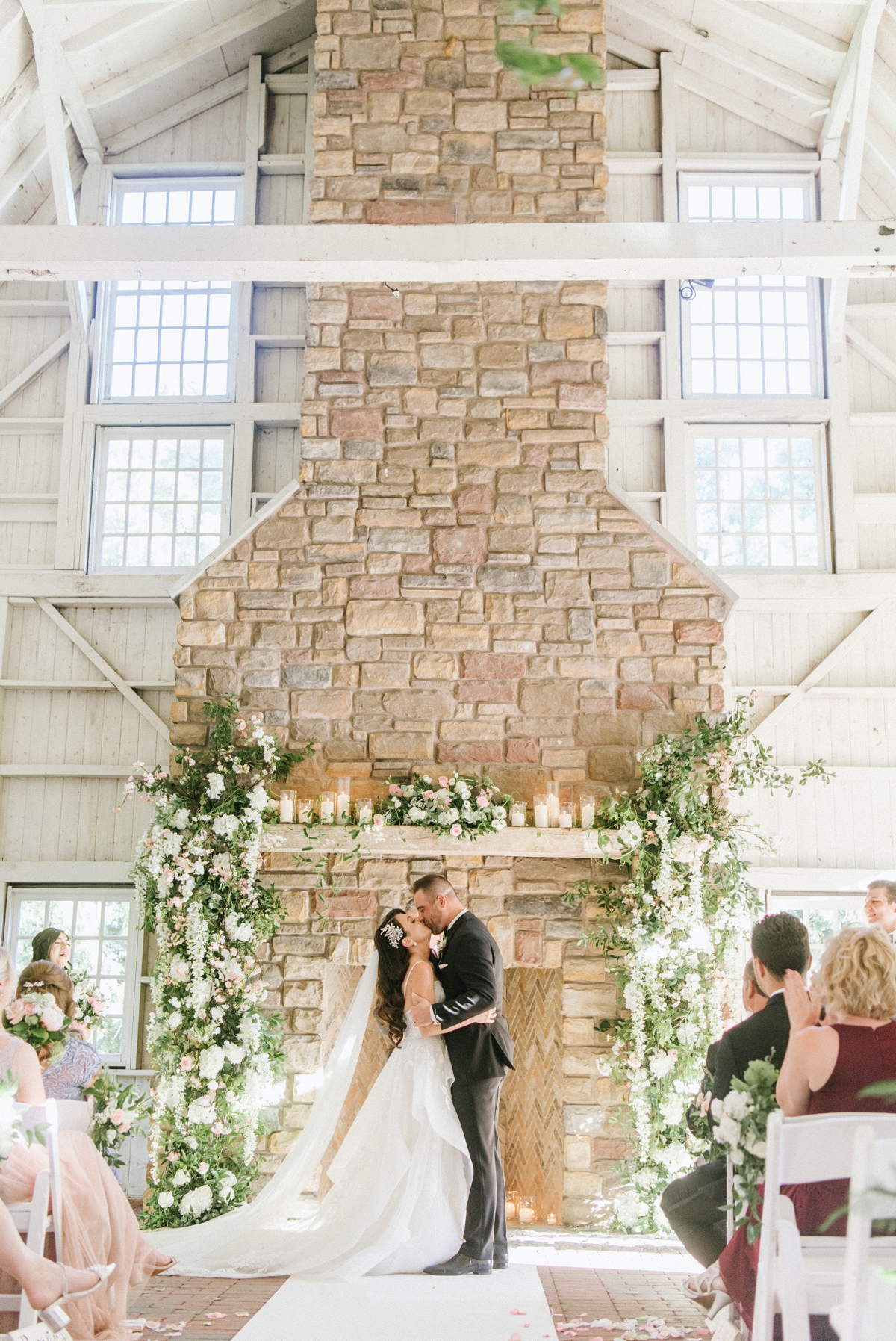 Weddings-of-distinction-Ashford-Estate-wedding-photos-cermony-kiss-light-airy
