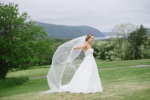The Garrison NY Wedding Upstate NY NJ Rustic Details first look bride and groom portraits greenery trees rustic bride veil toss mountain top
