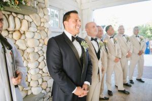 long beach island wedding lbi bonnet island estate jersey shore merrimaker caterers first look chapel love colorful bright bouquet flowers floral bride and groom love ceremony in chapel happy groom