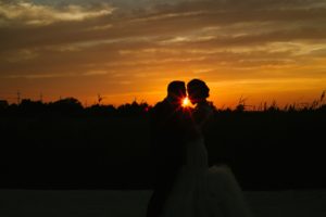 long beach island wedding lbi bonnet island estate jersey shore merrimaker caterers happy bride and groom candid happy sunset silhouette