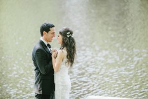 Cedar Lakes Estate Summer Wedding Port Jervis NY Camp Inspired Wood Forest Trees Greenery Just married Golf Cart happy love golden light bright kiss lake first look waterfront happy candid holding hands