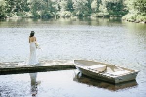 Cedar Lakes Estate Summer Wedding Port Jervis NY Camp Inspired Wood Forest Trees Greenery Just married Golf Cart happy love golden light bright lake details faye and renee flowers florals rustic barn bride bridal bouquet details row boat