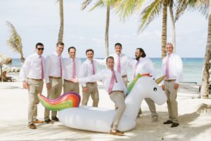 Jamaican Destination Wedding Island Resort sunshine groom and groomsmen portraits palm trees sunglasses beach fun funny candid unicorn tube