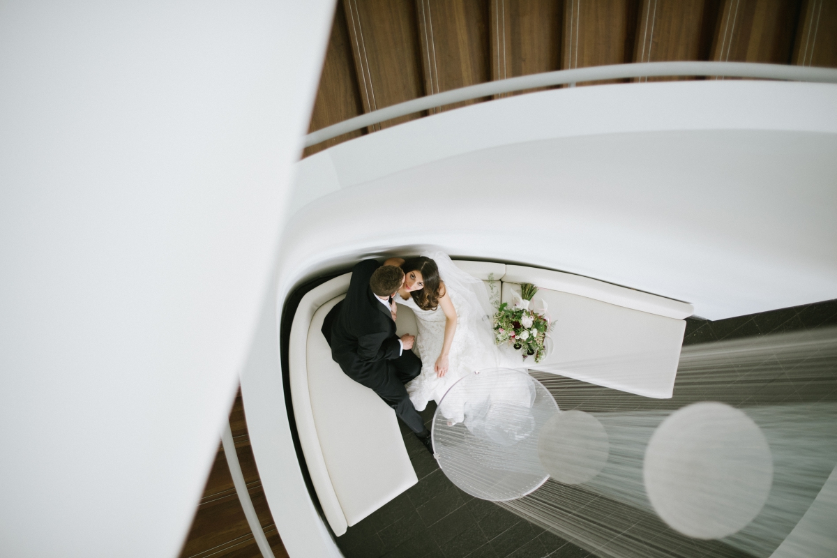 Interior aerial view Bride groom portraits happy Bouquets burgundy blushes rose flowers Hudson at Maritime Parc Jewish Wedding Jersey City