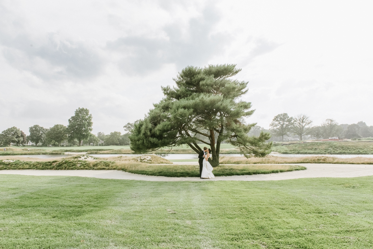 Manasquan River Golf Club Spring Lake NJ St. Catherine's Church Timeless Classic Wedding bride and groom wide landscape tree