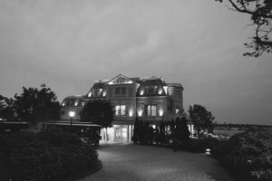 black and white night shot exterior outside The Chanler at Cliff Walk Newport Rhode Island New England Elegant Destination Wedding on the coast same sex couple lgbtq love is love gay couple love wins