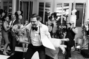 dancing lifting funny black and white candid reception The Chanler at Cliff Walk Newport Rhode Island New England Elegant Destination Wedding on the coast same sex couple lgbtq love is love gay couple love wins