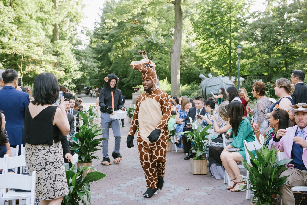 giraffe costume down the aisle ceremony Bronx Zoo Wedding Animal Lovers Keystone Endangered Species Environmentalists No Waste Wedding