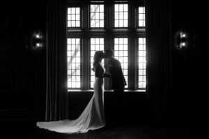 black and white silhouette kiss Natirar Mansion 90 acres wedding peapack NJ new jersey lush greenery