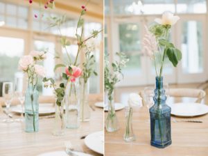 glass bottles flowers simple centerpieces Bear Brook Valley Wedding natural light
