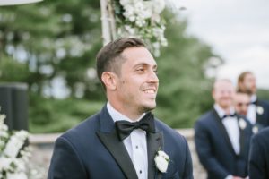 Rustic and elegant wedding at Laurita Winery Ceremony Groom SMiling