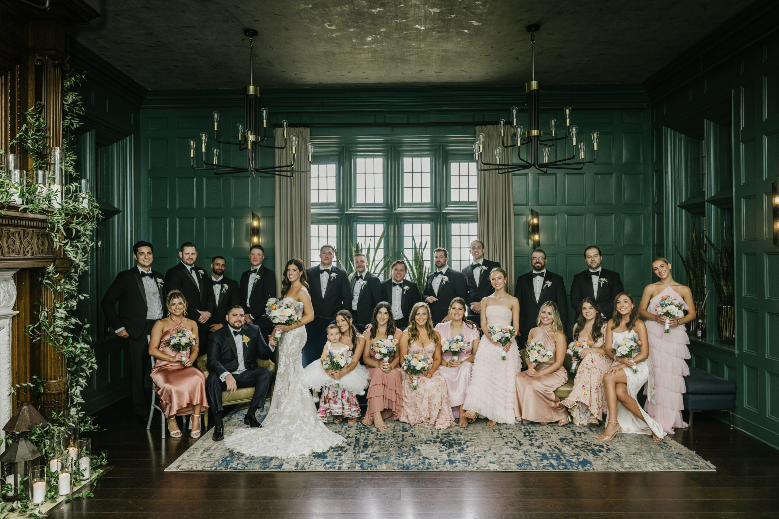 Wedding party portrait inside Natirar wedding venue featuring a dramatic green room and luxury indoor photo location in New Jersey.