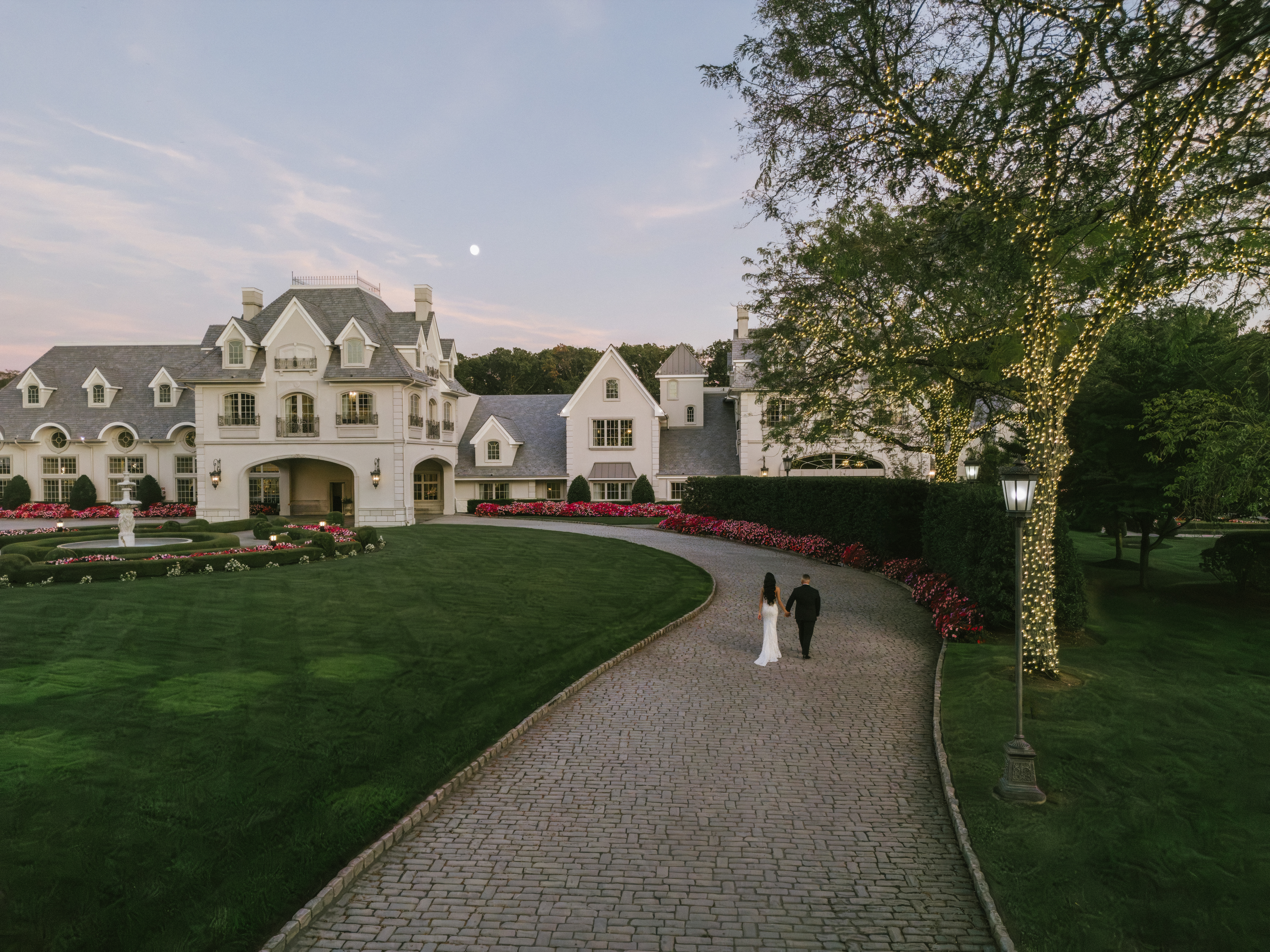 Aerial view of Park Château Estate and Gardens at sunset, a luxury all-inclusive New Jersey wedding venue
